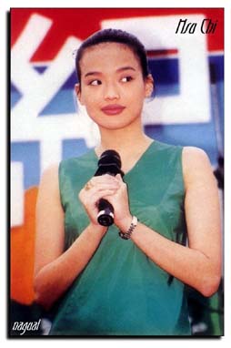 Shu Qi with a microphone